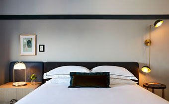 King bed, Black Headboard, white sheets